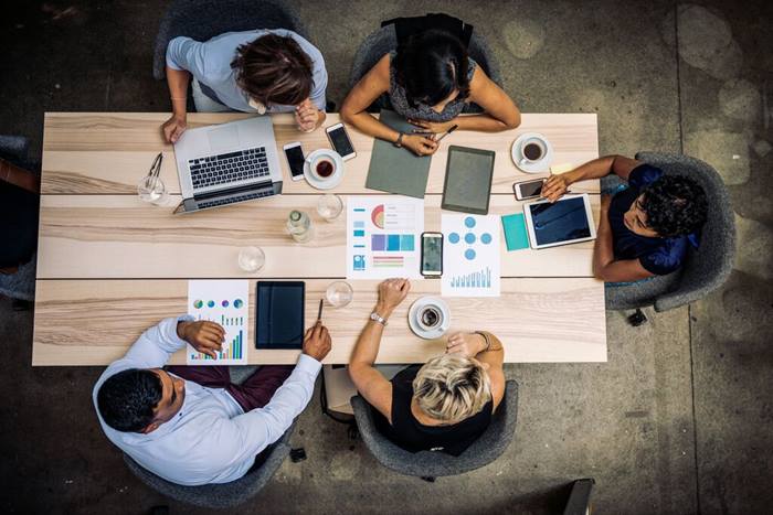 Group of financial professionals analyzing markets